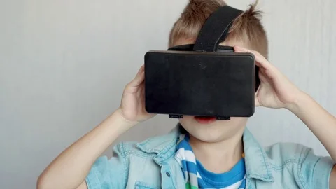 Little boy using virtual reality device in studio Video stock 70575104