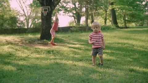 Little boy walking alone in the park 4k Stock Footage 75867090