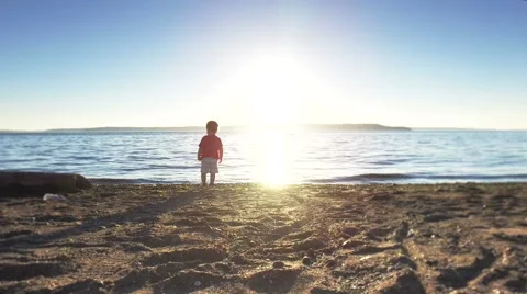 Little boy is walking on a beach. Stock Footage 64727212