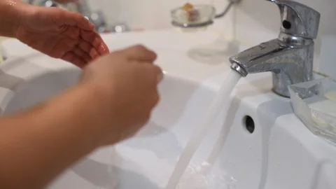 A little boy washes up in the bathroom Stock Footage 122106942