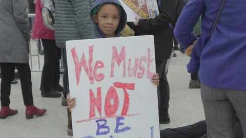 Little Boy We Must Not Be Silent Protest Sign - Womens March Stock Footage