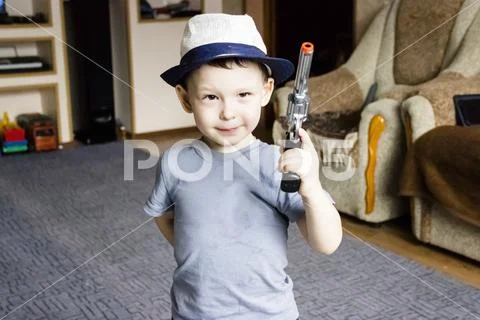 Little boy wearing a cowboy hat a over Stock Photos
