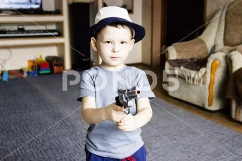 Little boy wearing a cowboy hat a over Stock Photos