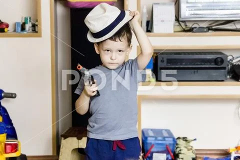 Little boy wearing a cowboy hat a over Stock Photos