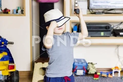 Little boy wearing a cowboy hat a over Stock Photos