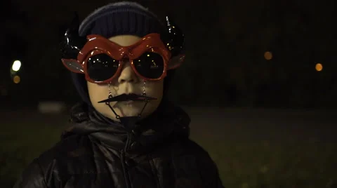 Little boy wearing devil mask on halloween party Stock Footage 68115918