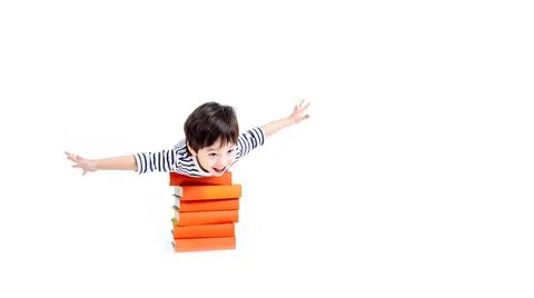Little boy wearing glasses with books on white background, education concept. Stock Photos