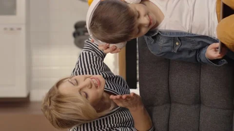 The little boy who playing games very much with his headset from the pad, Stock Footage 152047341