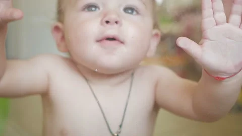 A little boy at the window Stock Footage 124788465