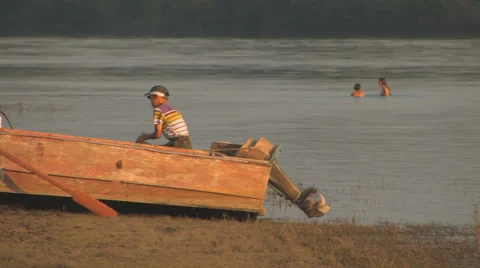 Little boy working hard while other children playing II Stock Footage 26096067