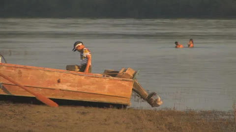 Little boy working hard while other children playing III Stock Footage 26097327