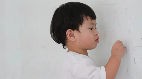 Little boy writing on wall background 스톡 동영상 55429074