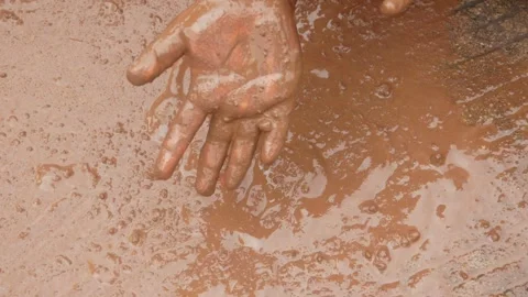 Little boy's hands playing with mud. Stock Footage 306777791
