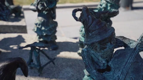 Little bronze dwarf midget statue playing music Stock-Footage 127376307