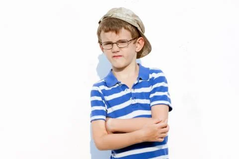 Little bully boy in a cap and glasses Stock Photos