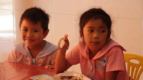 Little Cambodian Orphan Kids Smiling & Eating Stock Footage