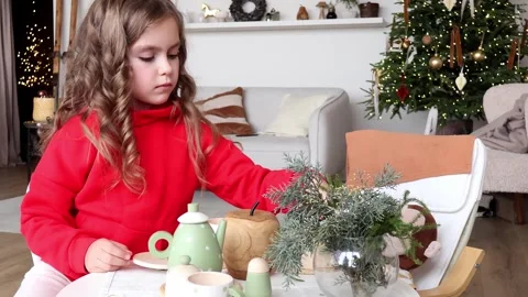 Little chef creates magic with festive table setting in cozy home 스톡 동영상 296324580