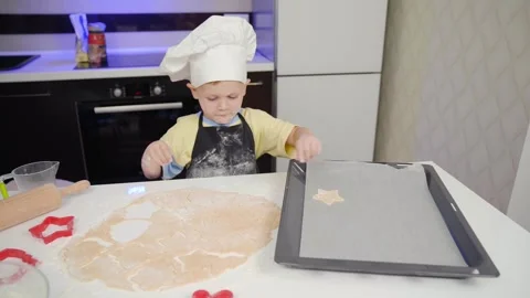 Little Chef Puts Dough on a Baking Pan Stock Footage 253434187