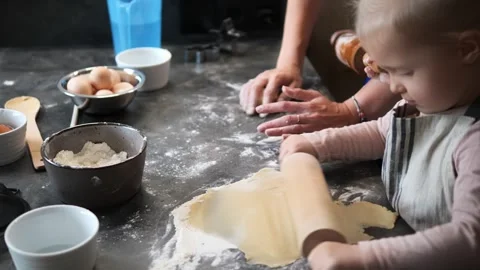 Little chefs make dough learning how to use flour, rolling pins, and gentle Stock Footage 289519588