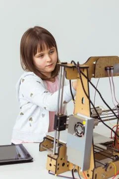 Little child architect using 3D Printer. Schoolgirl, technologies and study Stock Photos