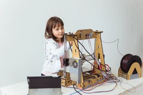 Little child architect using 3D Printer. Schoolgirl, technologies and study Stock Photos