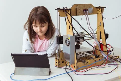 Little child architect using 3D Printer. Schoolgirl, technologies and study Stock Photos