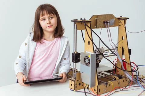 Little child architect using 3D Printer. Schoolgirl, technologies and study Stock Photos