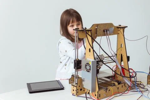 Little child architect using 3D Printer. Schoolgirl, technologies and study Stock Photos