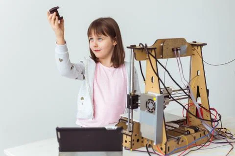 Little child architect using 3D Printer. Schoolgirl, technologies and study Stock Photos