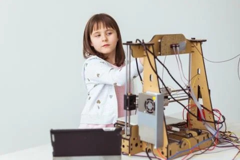 Little child architect using 3D Printer. Schoolgirl, technologies and study Stock Photos