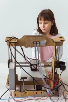 Little child architect using 3D Printer. Schoolgirl, technologies and study Stock Photos