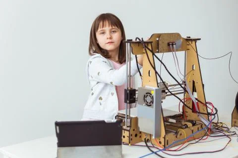 Little child architect using 3D Printer. Schoolgirl, technologies and study Stock Photos