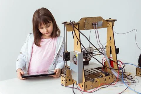 Little child architect using 3D Printer. Schoolgirl, technologies and study Stock Photos