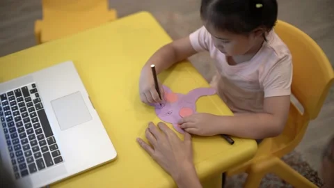Little child creating elephant shape from colored paper Video stock 159377108
