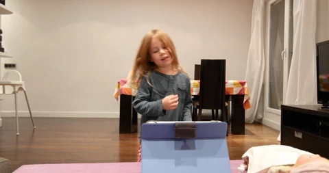 Little child dancing looking at tablet Stock Footage 88090195