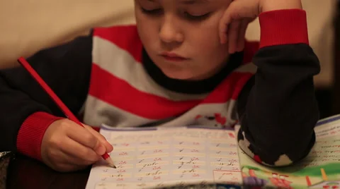 Little child doing homework Stock Footage 33689859