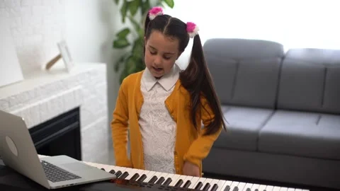 Little child girl playing the piano. Onl... | Stock Video