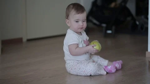 Little child with a green apple Stock Footage