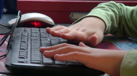 Little child hands typing at keyboard, pupil, computer, homework,school,close up Stock Footage 37085622