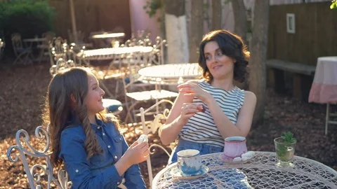 Little child has fun trying to feed his mother with marshmallows. Stock Footage 90333311