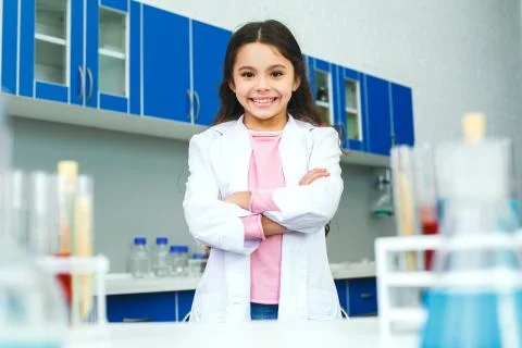 Little child with learning class in school laboratory standing confident Stock Photos