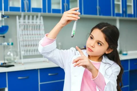 Little child with learning class in school laboratory plant sprout Stock Photos