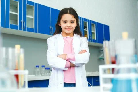 Little child with learning class in school laboratory serious Stock Photos