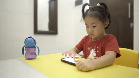 Little child learning to draw on smartphone Stock Footage 158775155