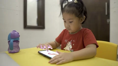 Little child learning to draw on smartphone Stock Footage 158775166