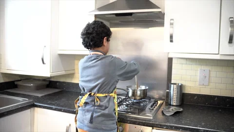 Little child learning how to cook. Stock Footage 262357882