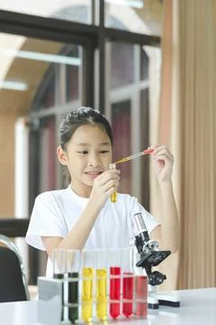 Little child with learning science class in school laboratory Stock Photos