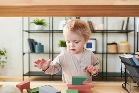 Little child playing with constructor Stock Photos