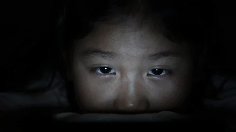 Little child playing smartphone lying on bed, Stock-Footage 112280415