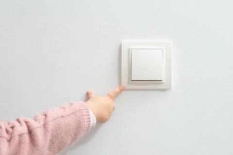Little child playing with switch Stock Photos